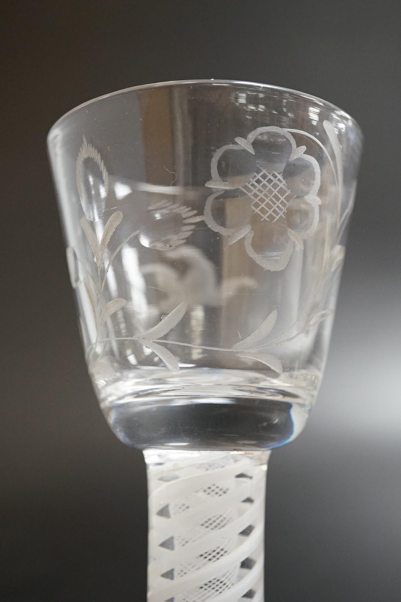 Two George III firing glasses, one with DSOT stem, together with a gin glass with engraved bowl, tallest 11.5cm high (3)